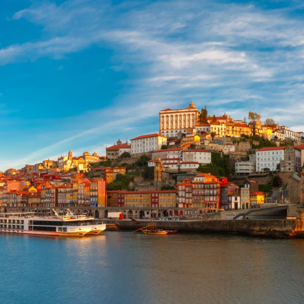 Panorama of Douro river, Ribeira and Dom Luis I or Luiz I iron bridge in the sunny morning Porto, Portugal.